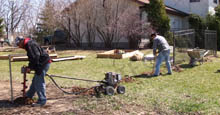 Dig Holes Setting Aluminum Fence Posts to Attach Fencing Panels and Gates